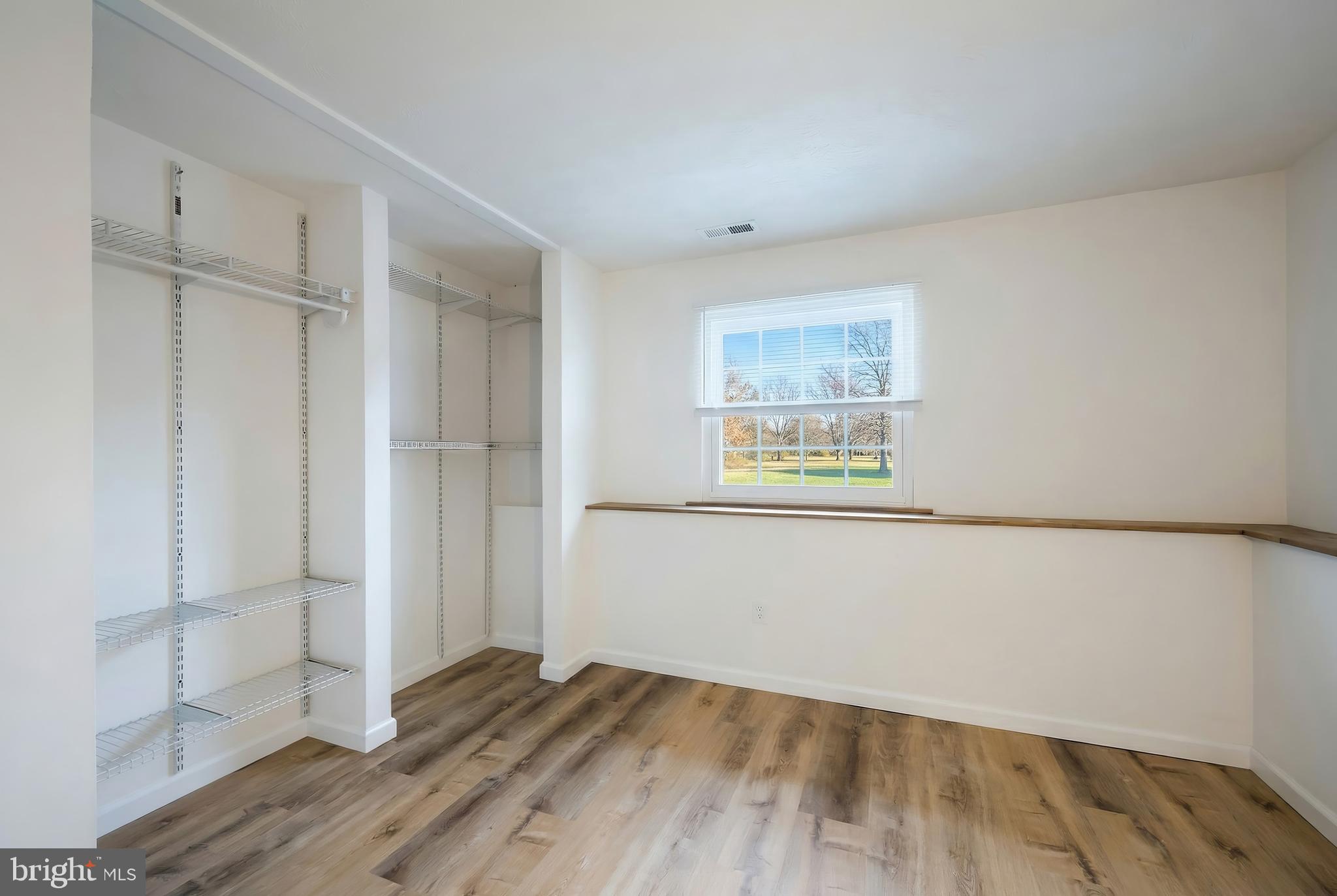 2 Dutton Road New Freedom, PA 17349 - Photo 27 of 39 a view of an empty room with wooden floor and a window