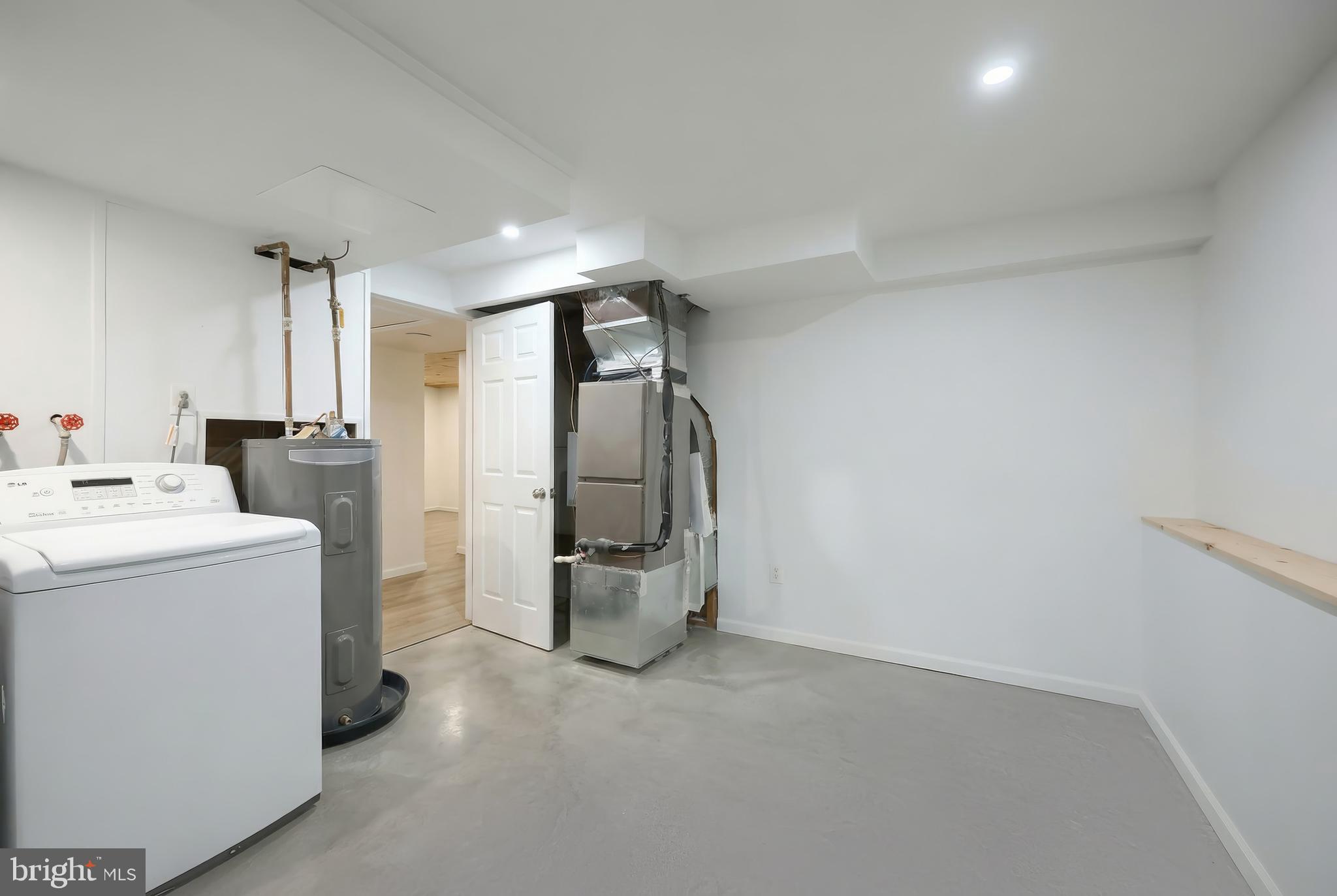 2 Dutton Road New Freedom, PA 17349 - Photo 28 of 39 a view of storage and utility room with washer and dryer