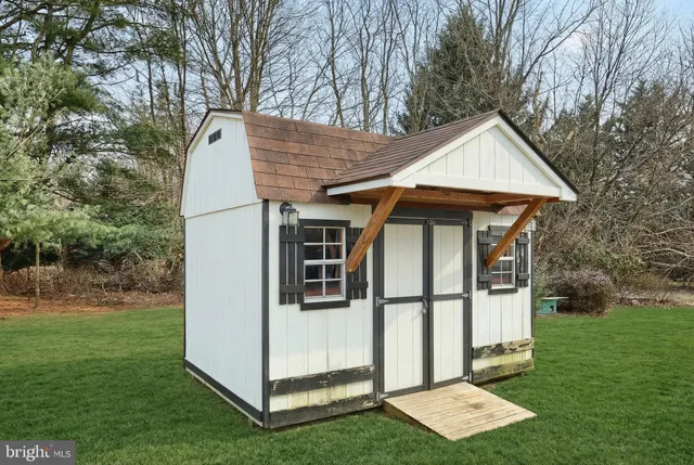 a view of a barn with a yard