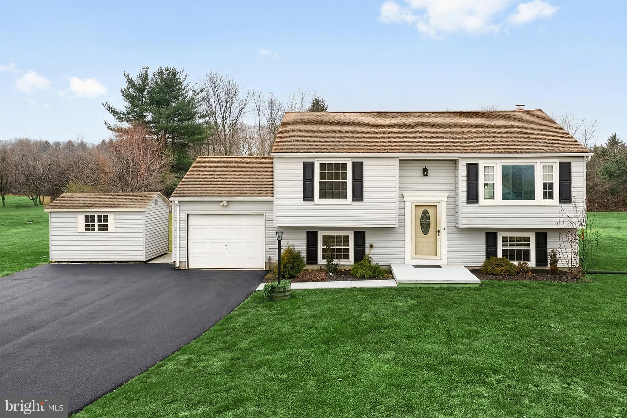 2 Dutton Road New Freedom, PA 17349 - Photo 5 of 39 a front view of a house with a yard and trees
