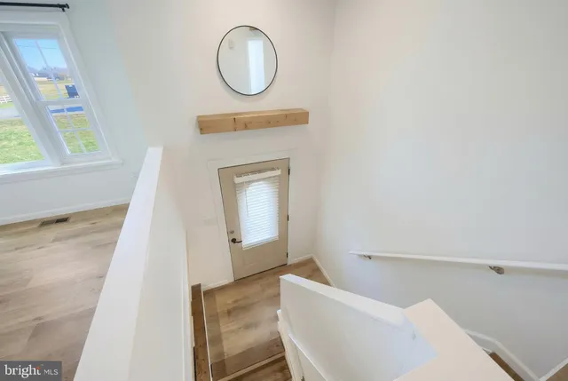 a living room with a couch and a large window