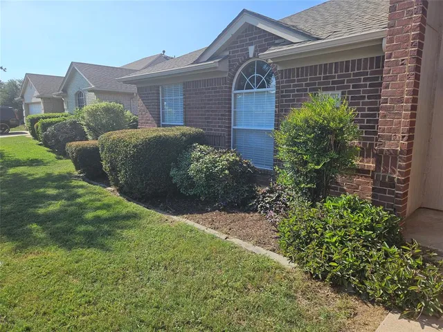 a view of a house with a garden