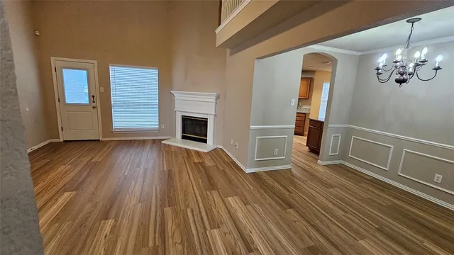 a view of livingroom with hardwood floor and a ceiling fan