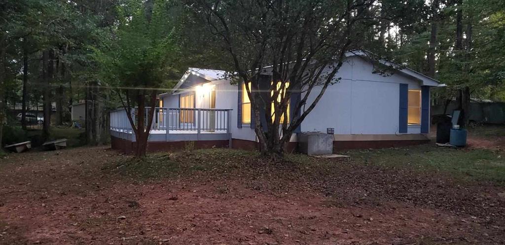 125 Sputnik Street Fortson, GA 31808 - Photo 23 of 30 a view of a house with a yard and large tree