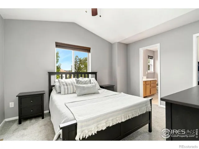 a bedroom with a bed and a tv