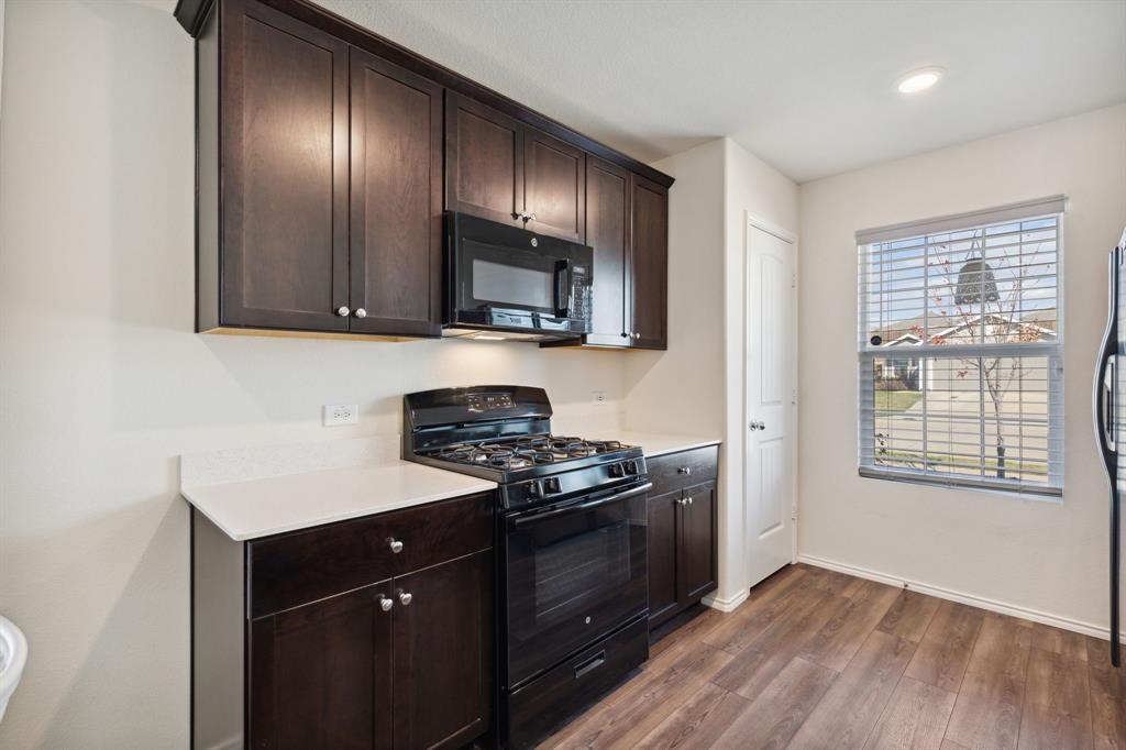 5513 Berea Street Forney, TX 75126 - Photo 5 of 29 Gas range and built-in microwave