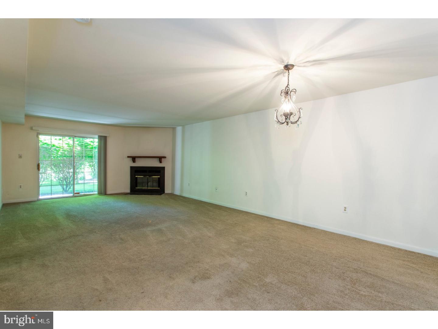 177 Valley Stream Lane Chesterbrook, PA 19087 - Photo 8 of 19 a view of empty room with fireplace and windows