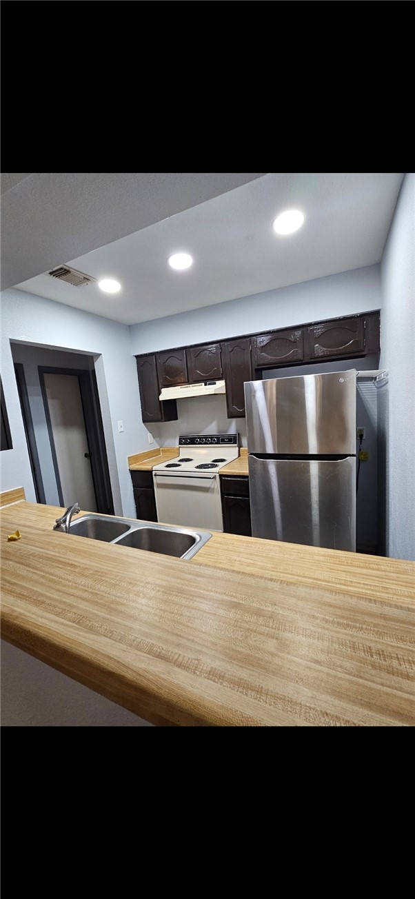 6702 Everhart Road, Unit K 104 Corpus Christi, TX 78413 - Photo 6 of 13 a view of kitchen with wooden floor