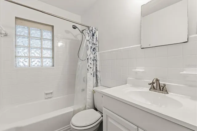 a bathroom with a sink a toilet and a bathtub