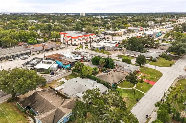 an aerial view of residential houses with outdoor space