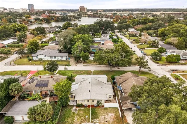 an aerial view of residential houses with outdoor space