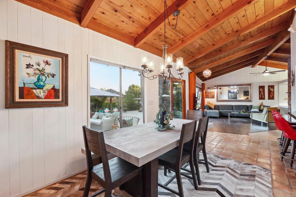 826 Ora Avo Drive Vista, CA 92084 - Photo 13 of 52 a dining room with furniture a rug and a large window