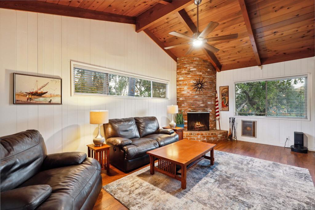 826 Ora Avo Drive Vista, CA 92084 - Photo 16 of 52 a living room with furniture a flat screen tv and a fireplace