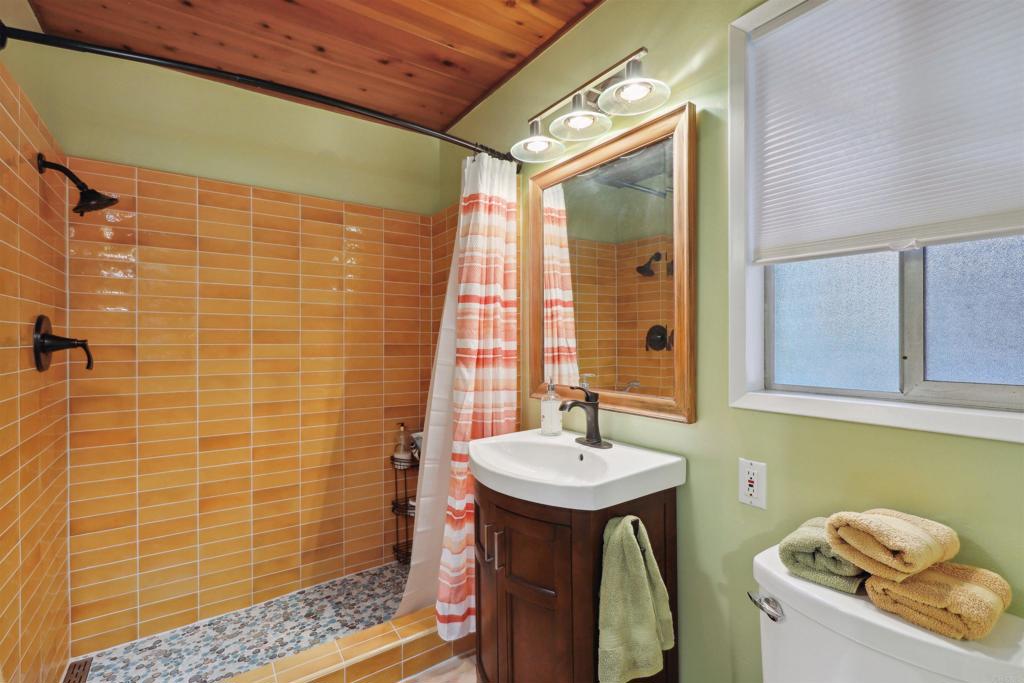 826 Ora Avo Drive Vista, CA 92084 - Photo 17 of 52 a bathroom with a sink a toilet and shower