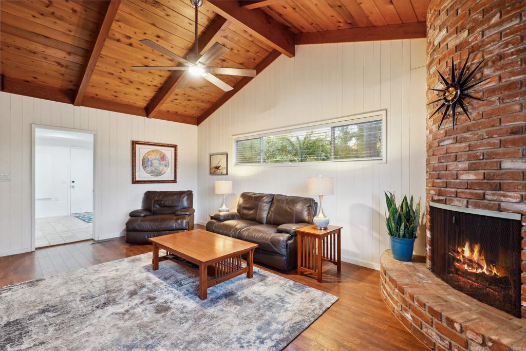 826 Ora Avo Drive Vista, CA 92084 - Photo 18 of 52 a living room with furniture a fireplace and a flat screen tv