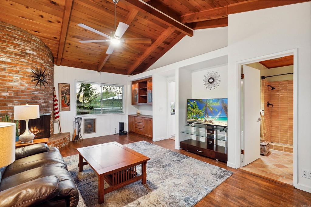 826 Ora Avo Drive Vista, CA 92084 - Photo 19 of 52 a living room with furniture a flat screen tv and a fireplace