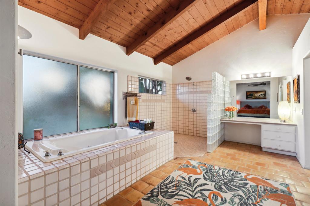 826 Ora Avo Drive Vista, CA 92084 - Photo 23 of 52 a bathroom with a tub sink and mirror
