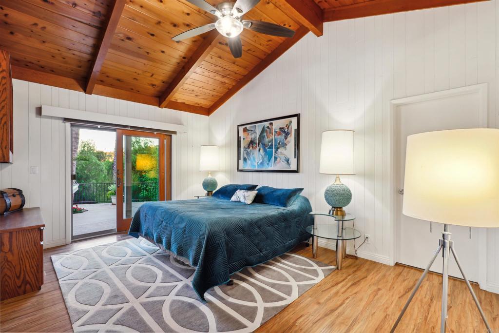 826 Ora Avo Drive Vista, CA 92084 - Photo 26 of 52 a bedroom with a bed and wooden floor