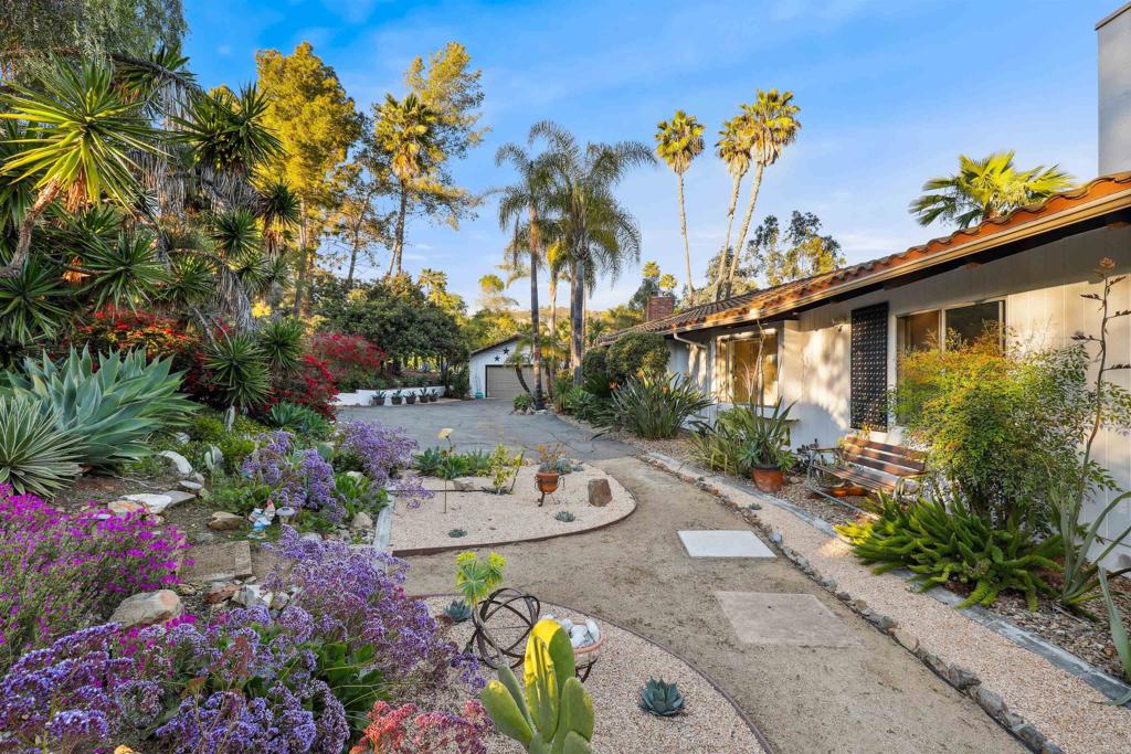826 Ora Avo Drive Vista, CA 92084 - Photo 3 of 52 a front view of a house with a lot of flower and flowers