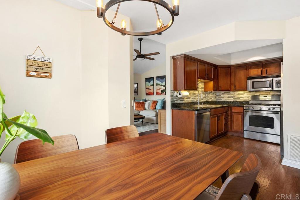 102 Sea Cliff Way Oceanside, CA 92056 - Photo 11 of 44 a kitchen with stainless steel appliances granite countertop a stove a sink and a microwave