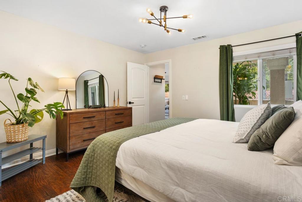 102 Sea Cliff Way Oceanside, CA 92056 - Photo 19 of 44 a bedroom with a bed and a dresser