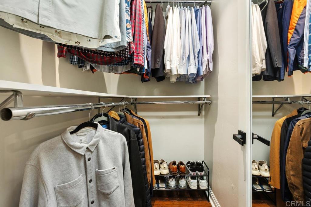 102 Sea Cliff Way Oceanside, CA 92056 - Photo 21 of 44 a view of walk in closet with clothes and shoes