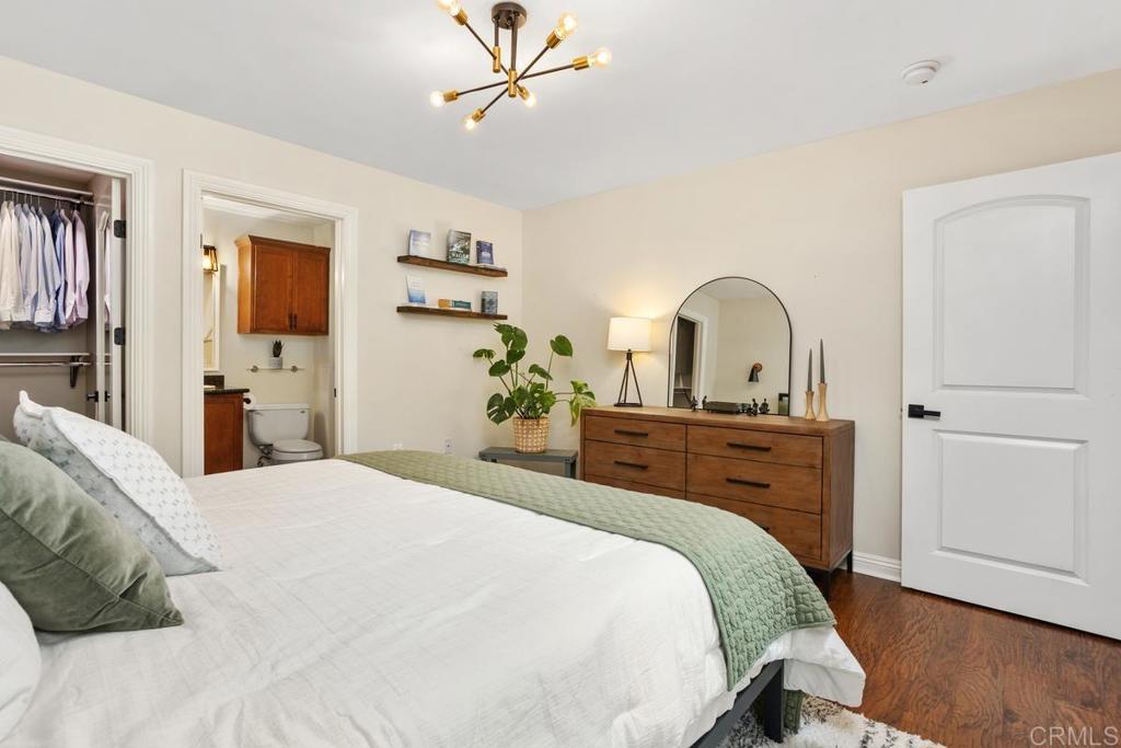 102 Sea Cliff Way Oceanside, CA 92056 - Photo 23 of 44 a bedroom with a bed and a dresser