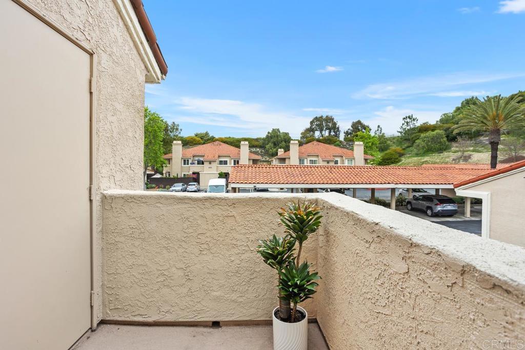 102 Sea Cliff Way Oceanside, CA 92056 - Photo 26 of 44 a view of a balcony with potted plants