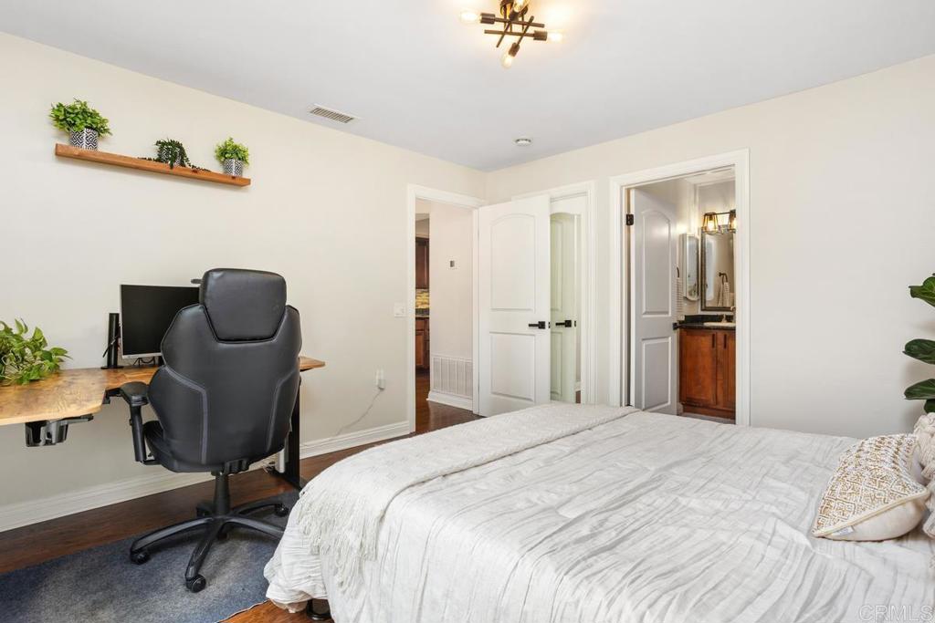 102 Sea Cliff Way Oceanside, CA 92056 - Photo 28 of 44 a bedroom with a bed and a chair