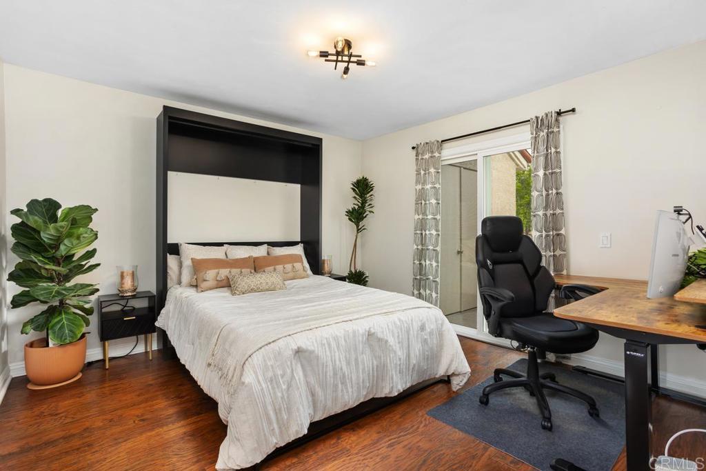 102 Sea Cliff Way Oceanside, CA 92056 - Photo 29 of 44 a bedroom with a bed table and a chair