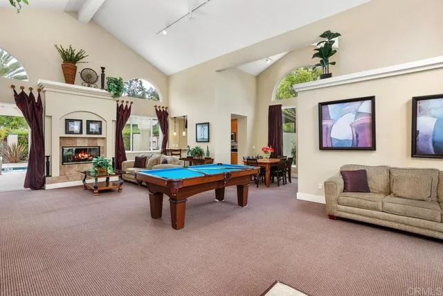 a vase of flowers sitting on a table in front of a window