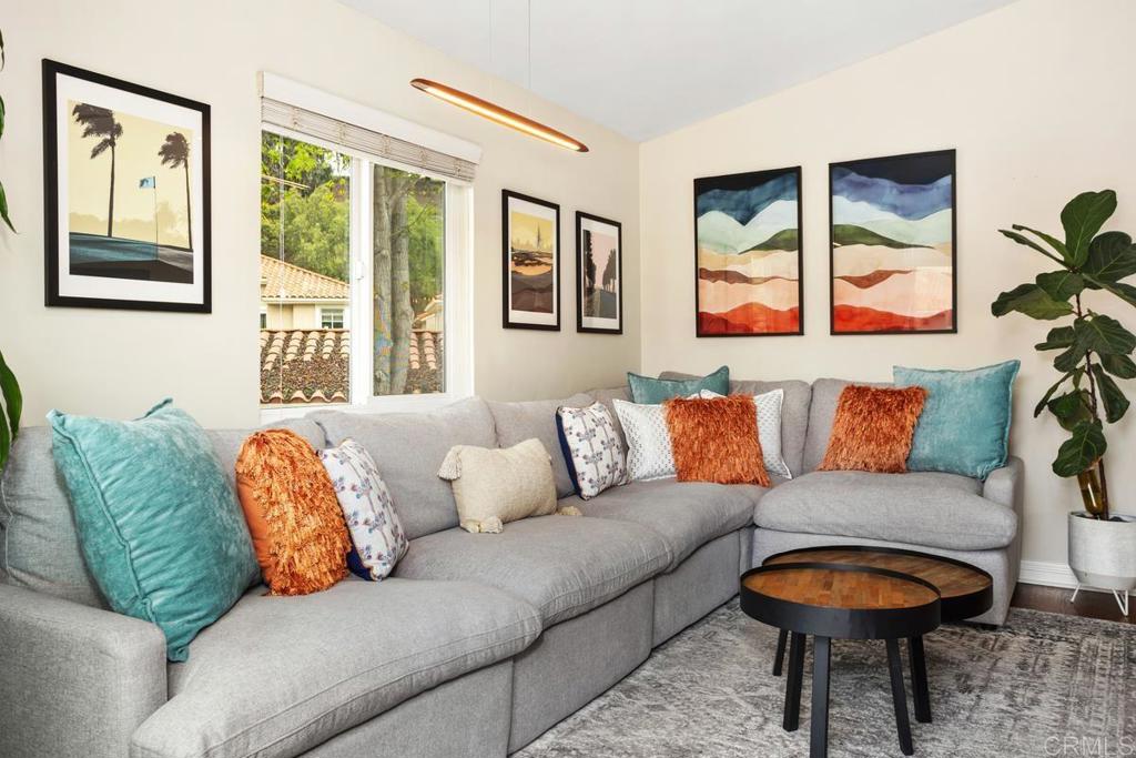102 Sea Cliff Way Oceanside, CA 92056 - Photo 8 of 44 a living room with furniture and a large window