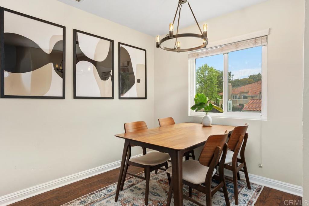 102 Sea Cliff Way Oceanside, CA 92056 - Photo 10 of 44 a view of a dining room with furniture window and wooden floor