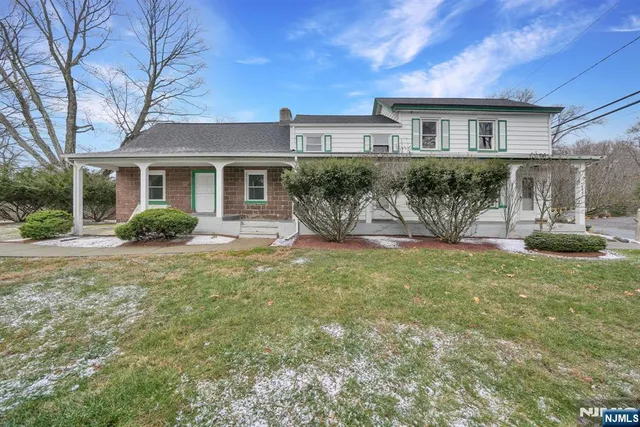 a house view with a garden space