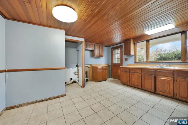 a kitchen with sink and window