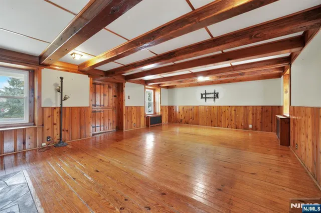 a view of a hall with wooden floor