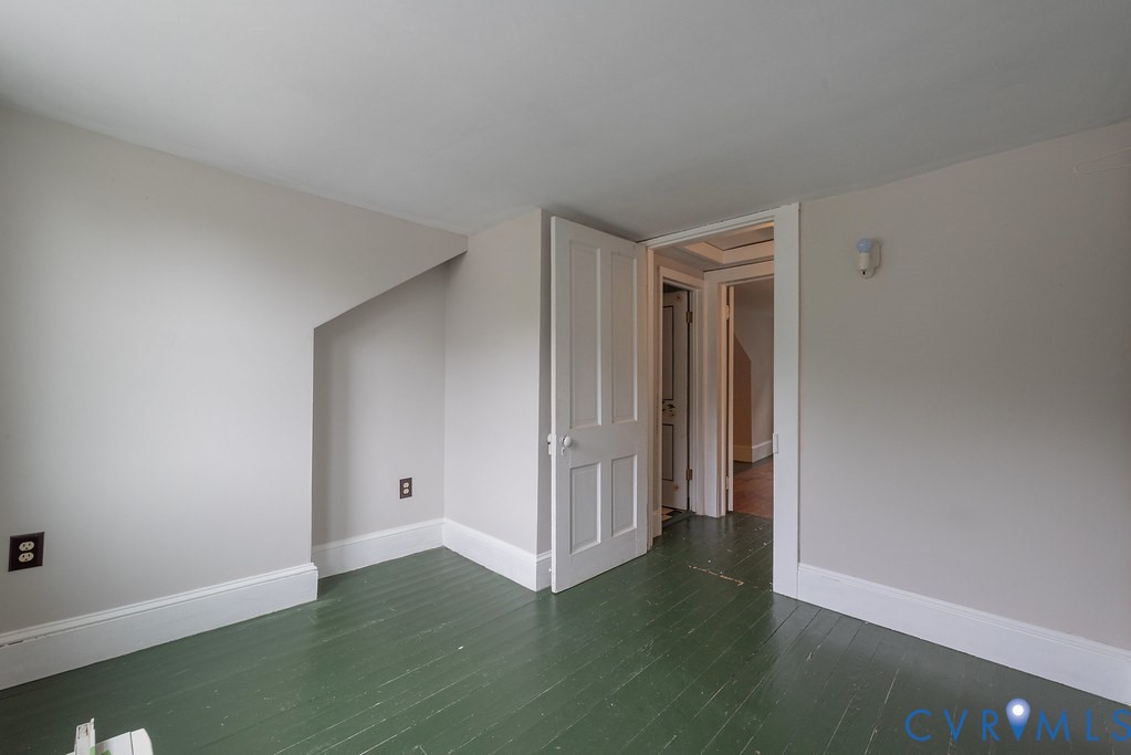 1881 Fairport Road Reedville, VA 22539 - Photo 31 of 54 White painted walls with sloped ceiling detail, pa