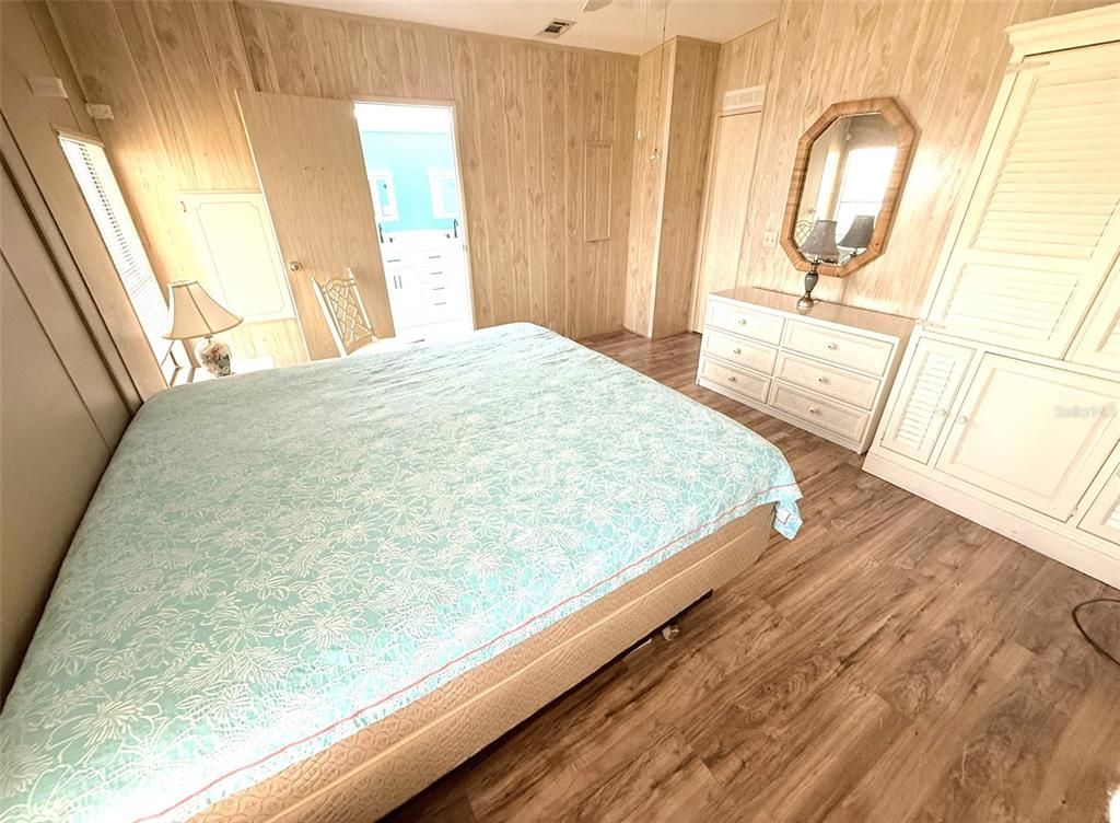 122 Rarotonga Road North Port, FL 34287 - Photo 18 of 48 a bed sitting in a bedroom next to a window