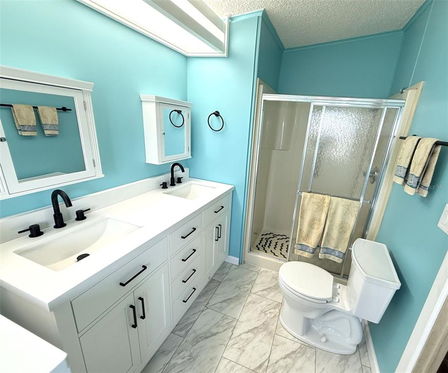 122 Rarotonga Road North Port, FL 34287 - Photo 20 of 48 a bathroom with a sink and mirror with toilet