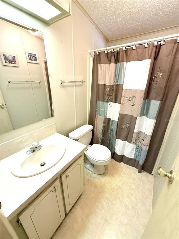 122 Rarotonga Road North Port, FL 34287 - Photo 23 of 48 a bathroom with a sink and a mirror