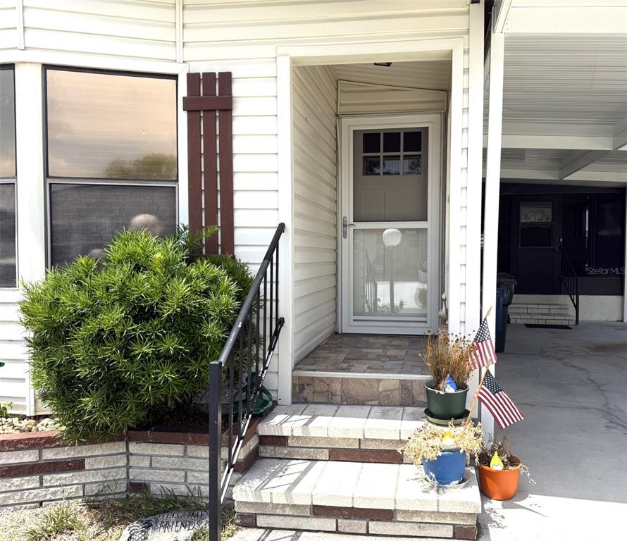 122 Rarotonga Road North Port, FL 34287 - Photo 5 of 48 a front view of a house with a yard