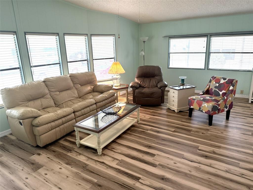 122 Rarotonga Road North Port, FL 34287 - Photo 7 of 48 a living room with furniture and a large window