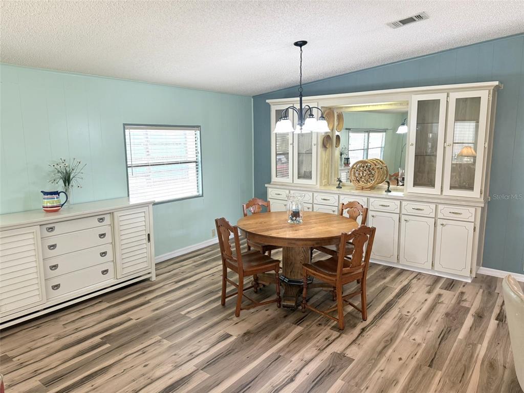 122 Rarotonga Road North Port, FL 34287 - Photo 9 of 48 a view of a dining room with furniture window and outside view