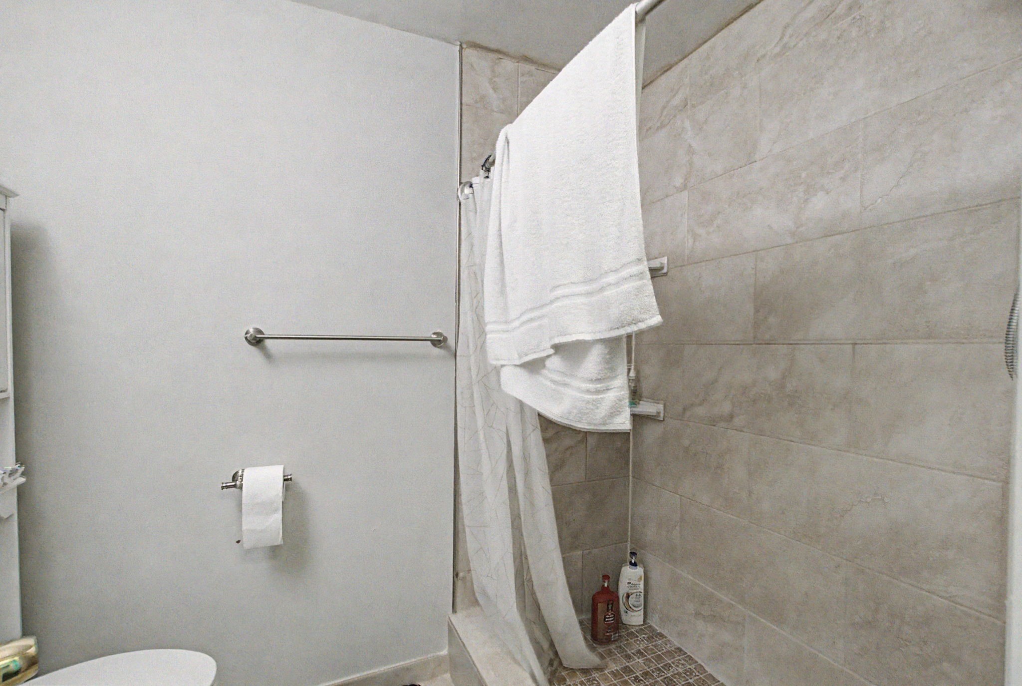 10034 Alfred Lane Houston, TX 77041 - Photo 31 of 50 Refresh and recharge in a beautifully updated bath featuring a sleek walk-in shower and timeless finishes.