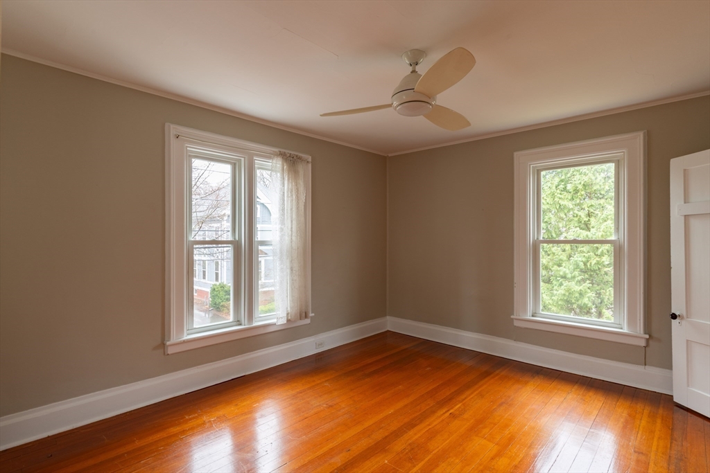 29 Pomeroy Terrace Northampton, MA 01060 - Photo 17 of 23 a view of empty room with wooden floor and fan