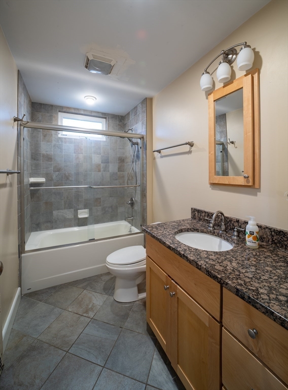 29 Pomeroy Terrace Northampton, MA 01060 - Photo 18 of 23 a bathroom with a granite countertop sink a toilet and bathtub