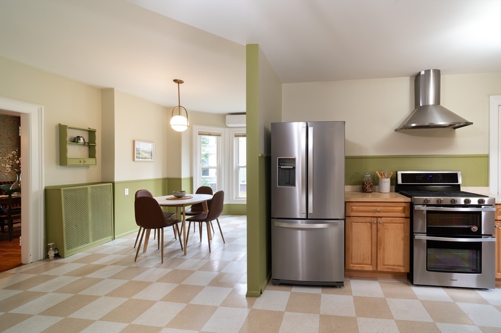 29 Pomeroy Terrace Northampton, MA 01060 - Photo 9 of 23 a kitchen with stainless steel appliances granite countertop a refrigerator a stove a sink and a dining table