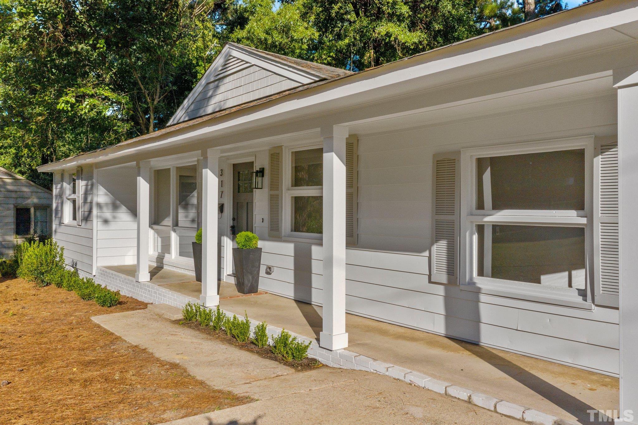317 Quail Drive Raleigh, NC 27604 - Photo 2 of 29 a view of a house with a porch