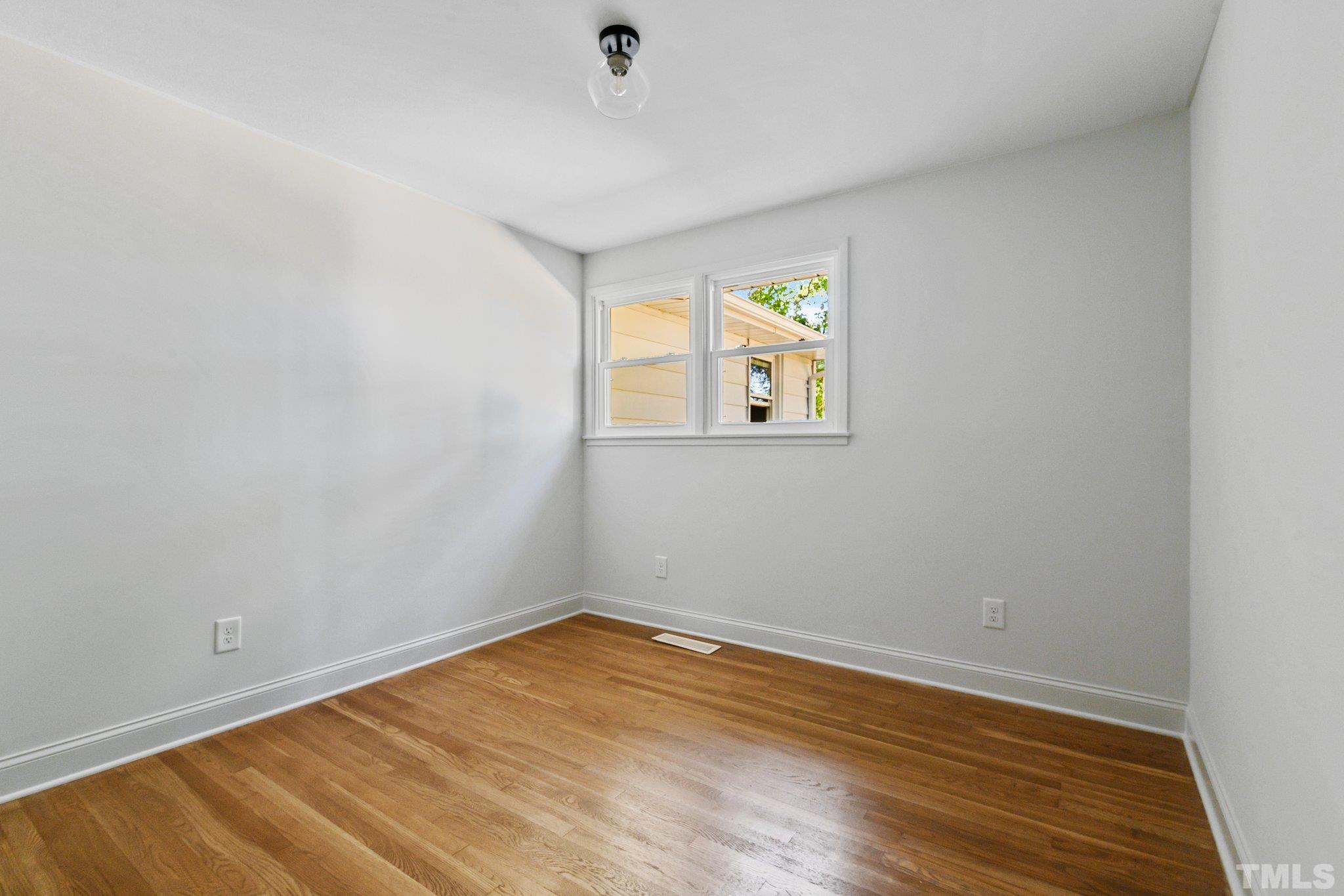 317 Quail Drive Raleigh, NC 27604 - Photo 13 of 29 an empty room with a window