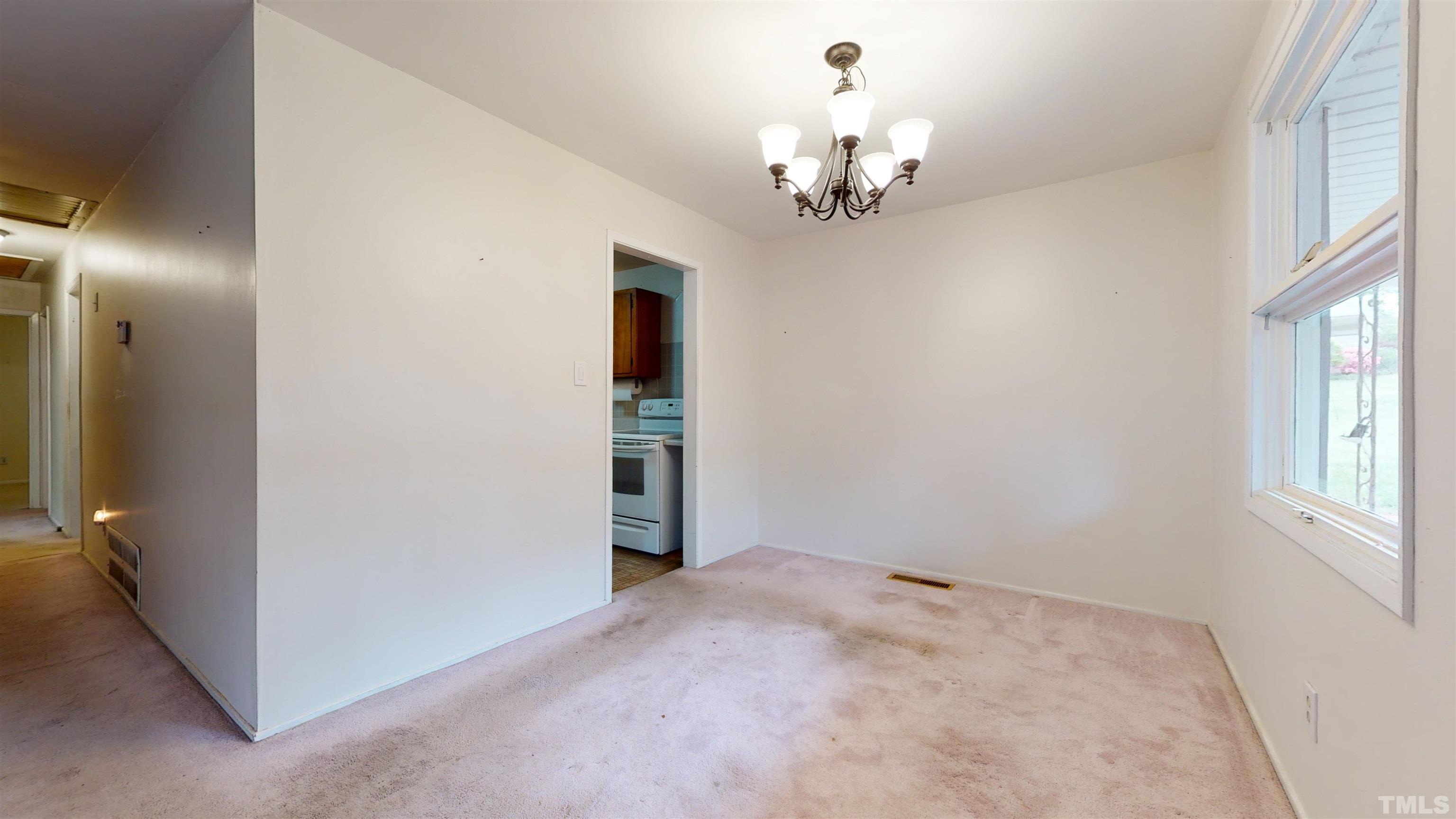 317 Quail Drive Raleigh, NC 27604 - Photo 28 of 29 wooden floor in an empty room with a window